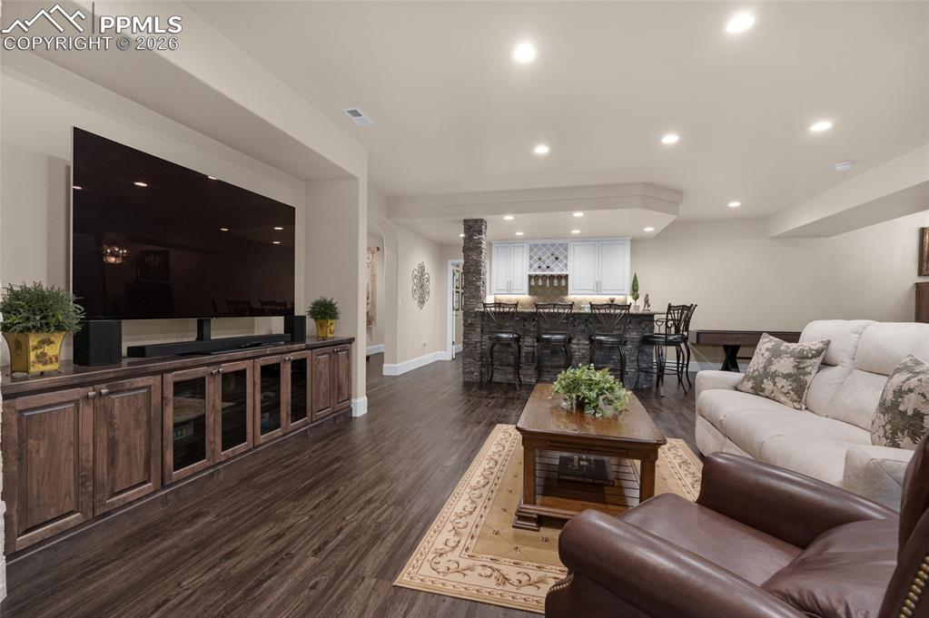13320 Clinet Drive Colorado Springs, CO 80921 - Photo 28 of 50 a living room with furniture and a flat screen tv