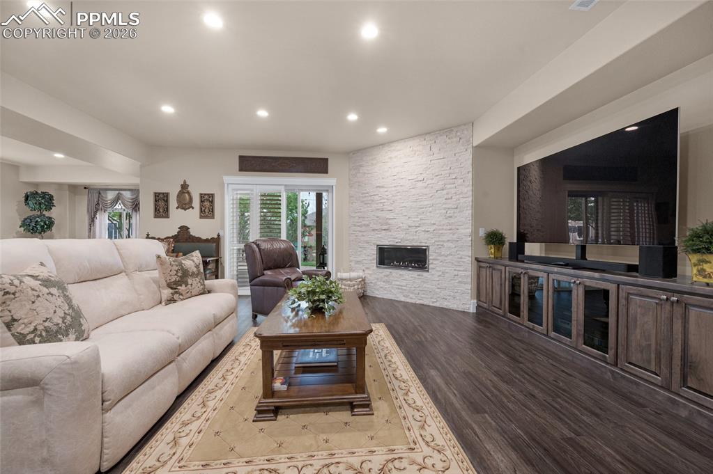 13320 Clinet Drive Colorado Springs, CO 80921 - Photo 29 of 50 a living room with furniture and a wooden floor