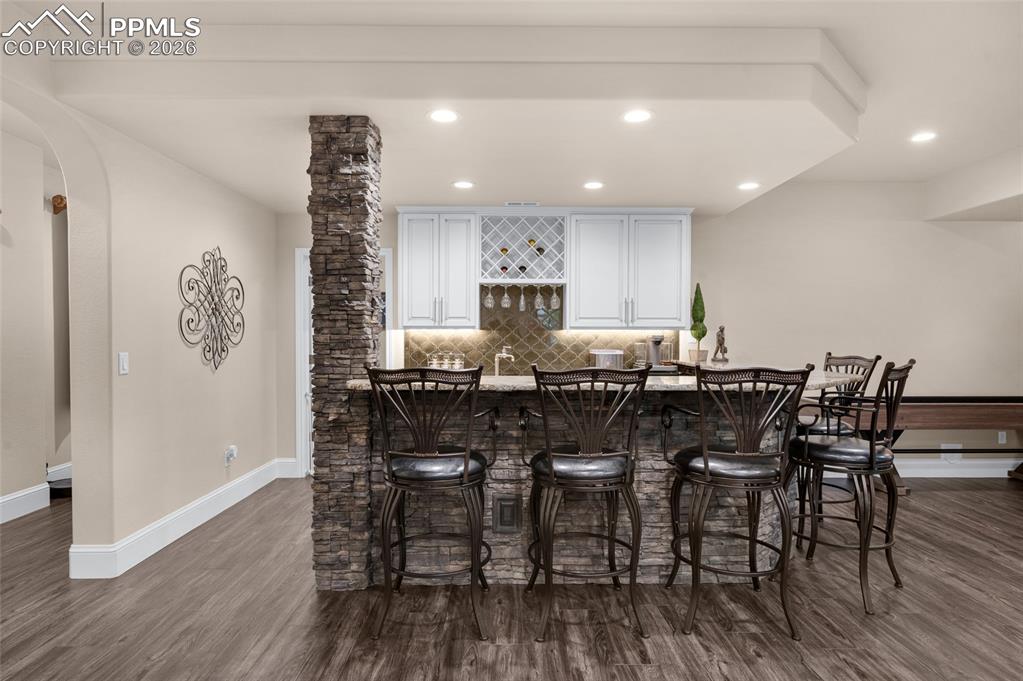 13320 Clinet Drive Colorado Springs, CO 80921 - Photo 31 of 50 a view of a dining room with furniture and wooden floor