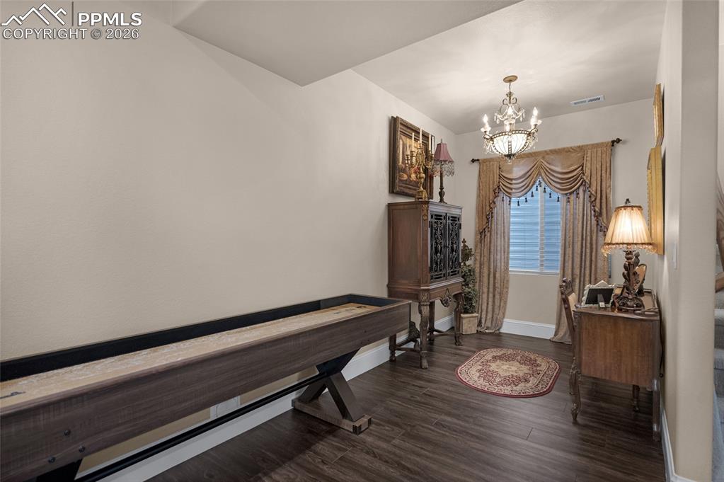 13320 Clinet Drive Colorado Springs, CO 80921 - Photo 35 of 50 a room with furniture and wooden floor