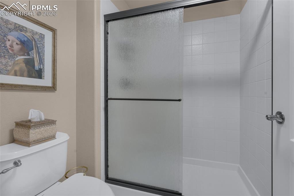 13320 Clinet Drive Colorado Springs, CO 80921 - Photo 37 of 50 a bathroom with a shower and a toilet