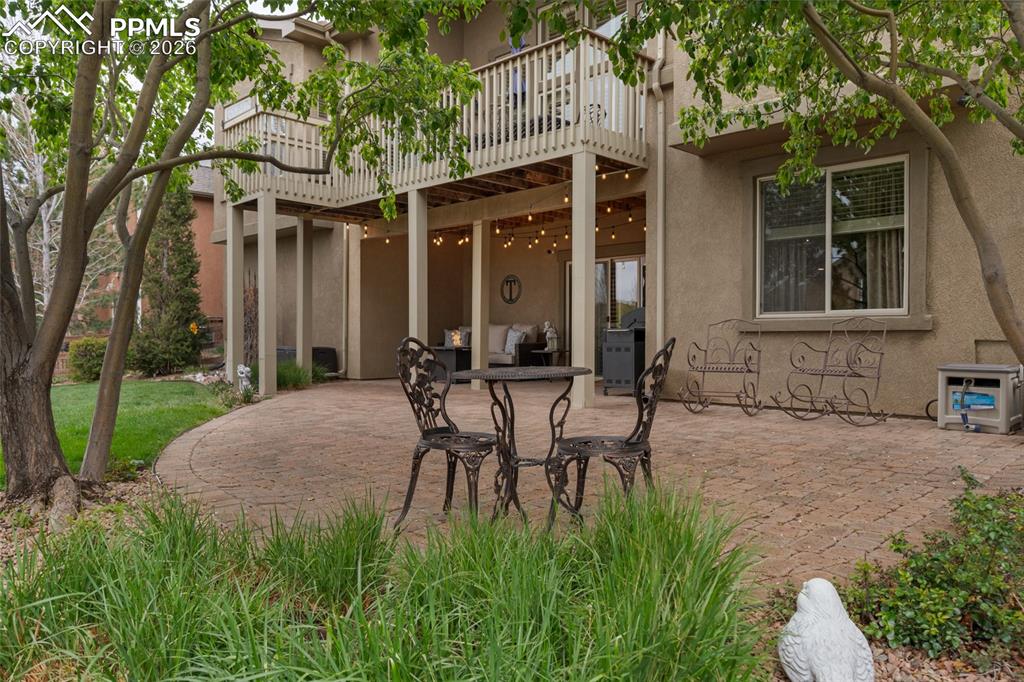 13320 Clinet Drive Colorado Springs, CO 80921 - Photo 46 of 50 a view of a patio with table and chairs and potted plants