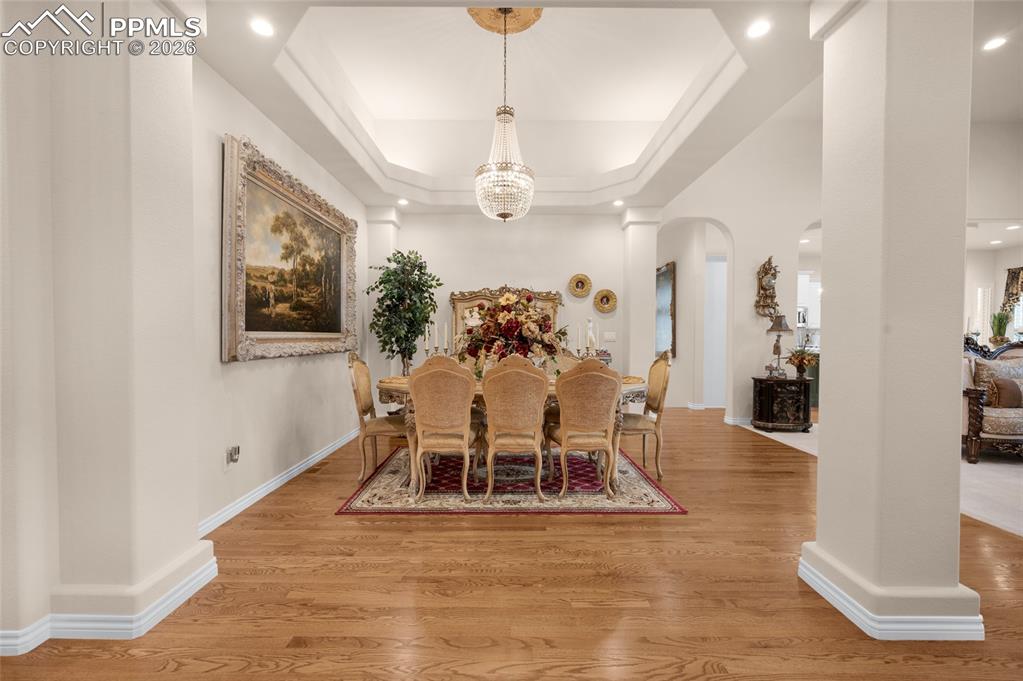 13320 Clinet Drive Colorado Springs, CO 80921 - Photo 5 of 50 a view of a dining room with furniture and chandelier