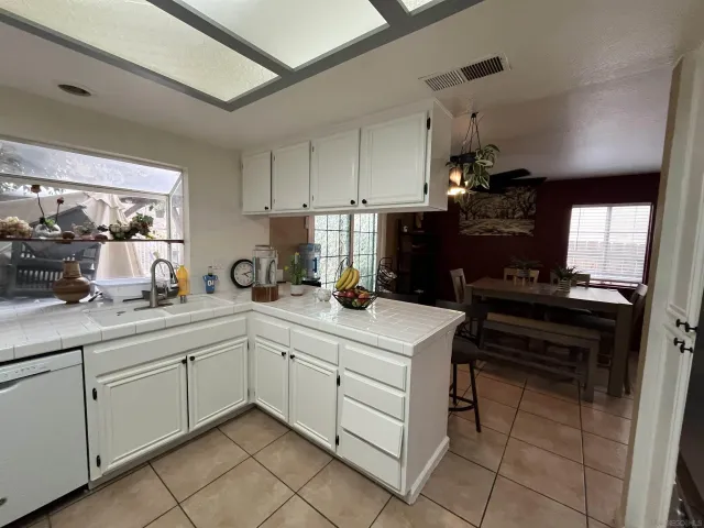 a kitchen with a sink and cabinets