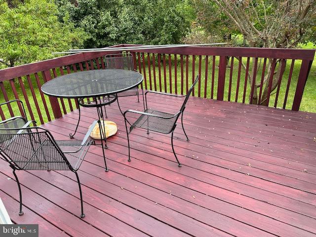 802 Woodline Drive Middletown, DE 19709 - Photo 13 of 13 a view of balcony with wooden floor and outdoor seating