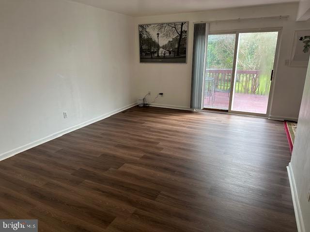 802 Woodline Drive Middletown, DE 19709 - Photo 2 of 13 a view of a room with wooden floor and large window
