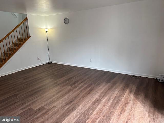 802 Woodline Drive Middletown, DE 19709 - Photo 3 of 13 a view of an empty room with wooden floor and stairs