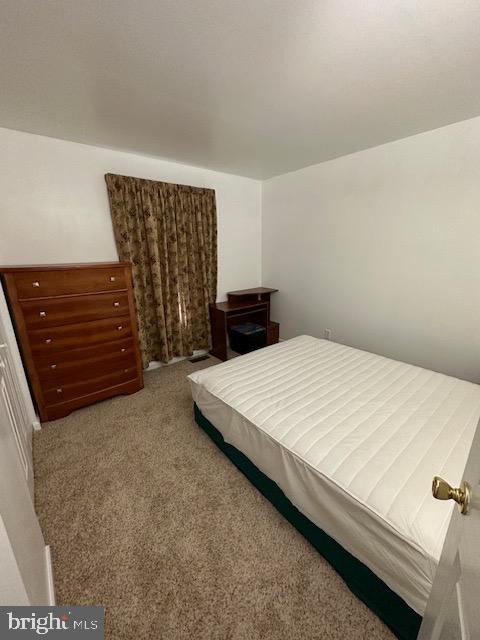 802 Woodline Drive Middletown, DE 19709 - Photo 5 of 13 a bed sitting in a bedroom and wooden floor