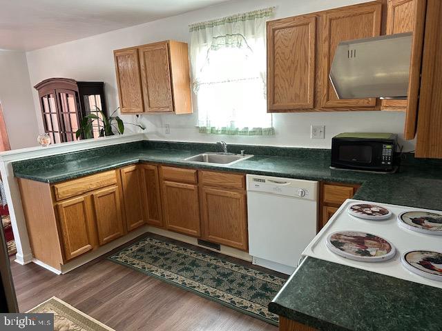 802 Woodline Drive Middletown, DE 19709 - Photo 7 of 13 a kitchen with stainless steel appliances granite countertop a stove a sink and a microwave