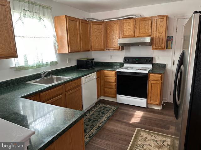 802 Woodline Drive Middletown, DE 19709 - Photo 8 of 13 a kitchen with stainless steel appliances granite countertop a sink stove and refrigerator