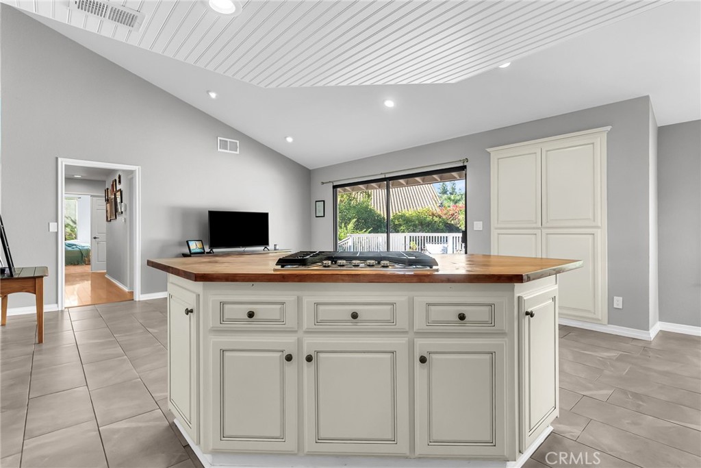 10651 Orchard View Lane Riverside, CA 92503 - Photo 12 of 35 a living room with kitchen island furniture and flat screen tv