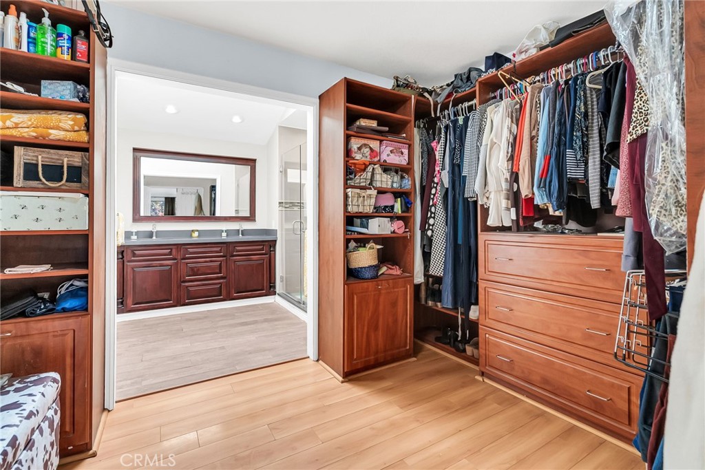 10651 Orchard View Lane Riverside, CA 92503 - Photo 16 of 35 a view of walk in closet with clothes and shoes