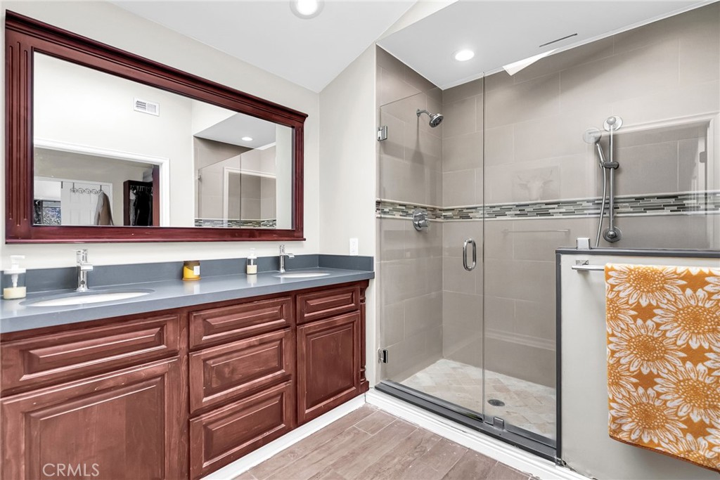 10651 Orchard View Lane Riverside, CA 92503 - Photo 17 of 35 a bathroom with a shower sink and mirror