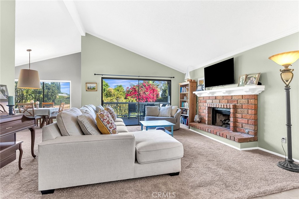 10651 Orchard View Lane Riverside, CA 92503 - Photo 2 of 35 a living room with fireplace furniture and a flat screen tv