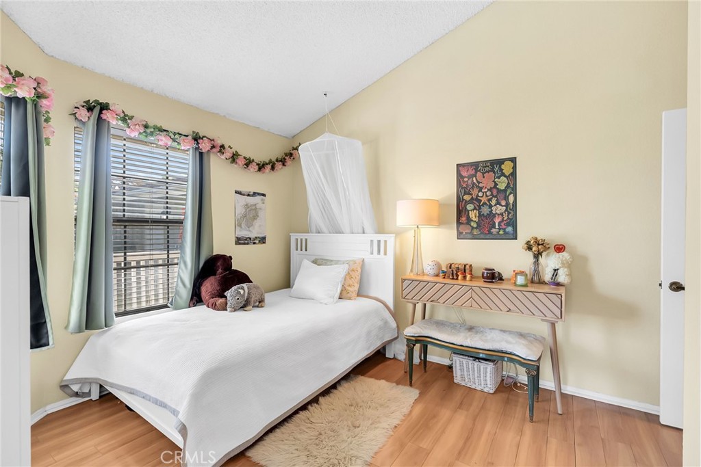 10651 Orchard View Lane Riverside, CA 92503 - Photo 21 of 35 a bedroom with a bed and a table in it