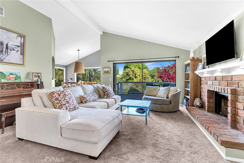 10651 Orchard View Lane Riverside, CA 92503 - Photo 3 of 35 a living room with fireplace furniture and a flat screen tv