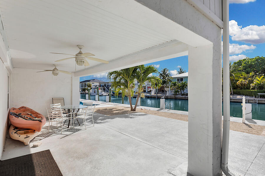 303 Sombrero Beach Road Marathon, FL 33050 - Photo 68 of 84 Side A-covered outdoor lounge area