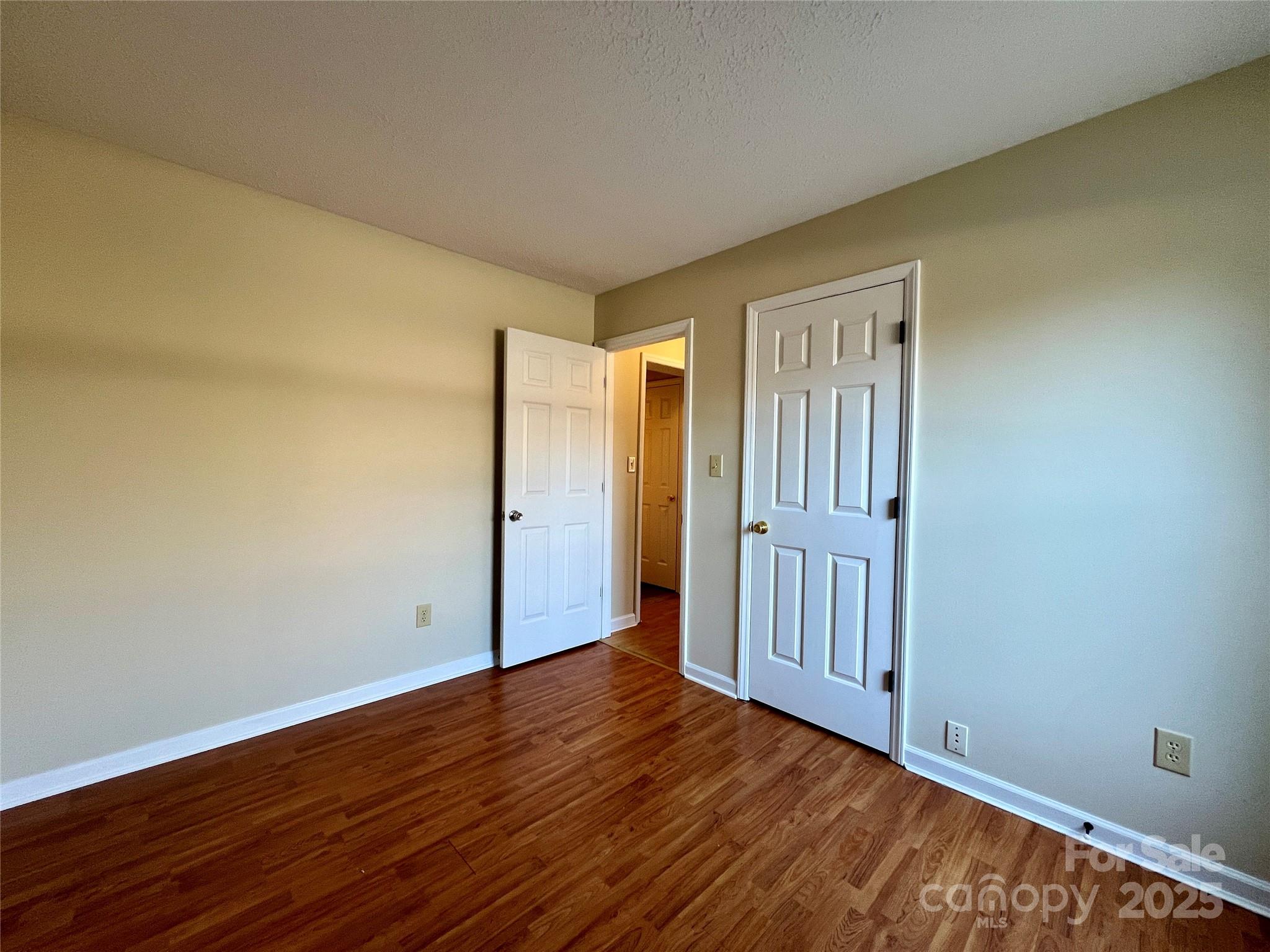 3 Wesley Branch Road Asheville, NC 28806 - Photo 11 of 19 a view of an empty room with wooden floor