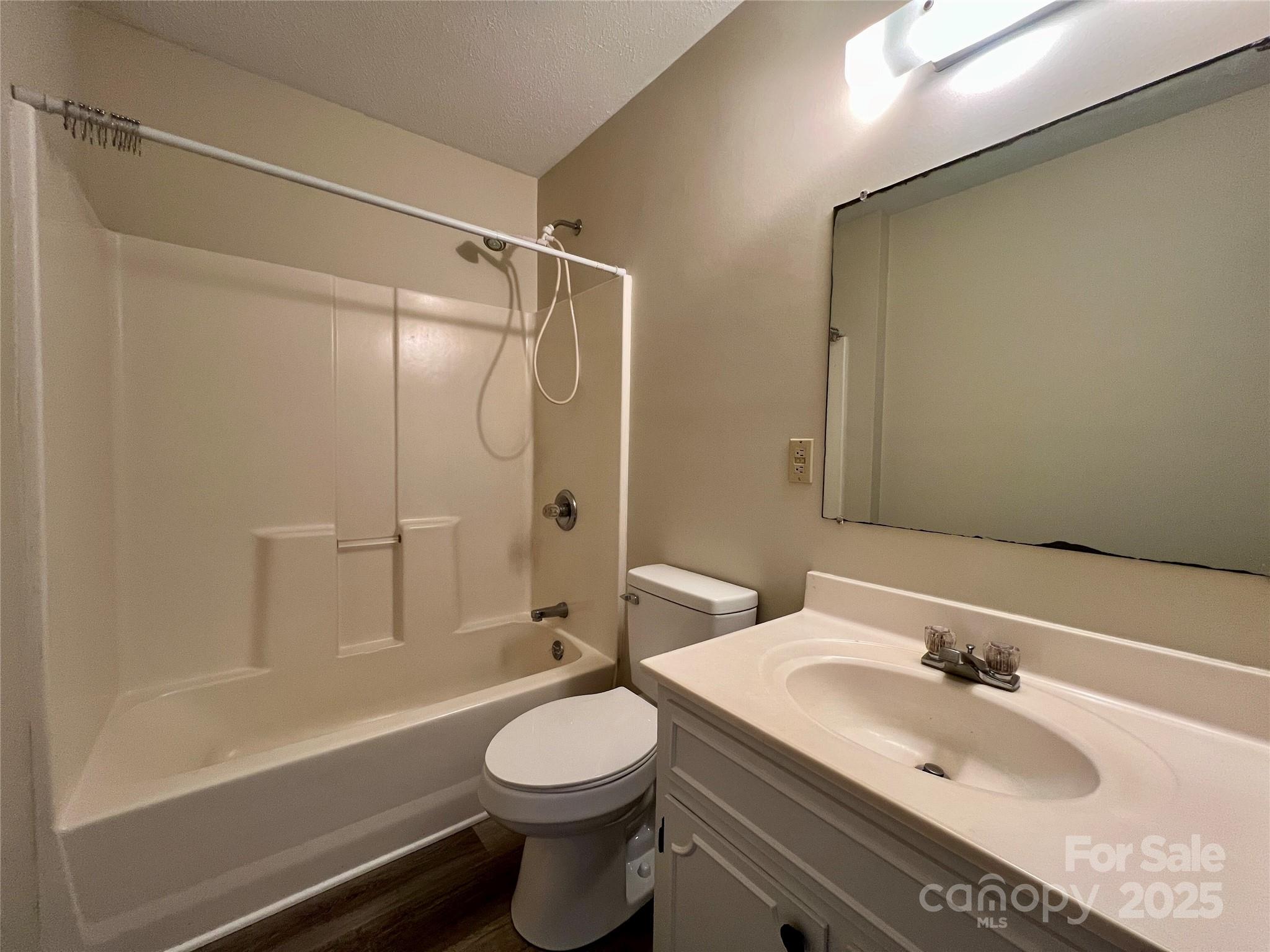 3 Wesley Branch Road Asheville, NC 28806 - Photo 12 of 19 a bathroom with a sink a toilet and shower
