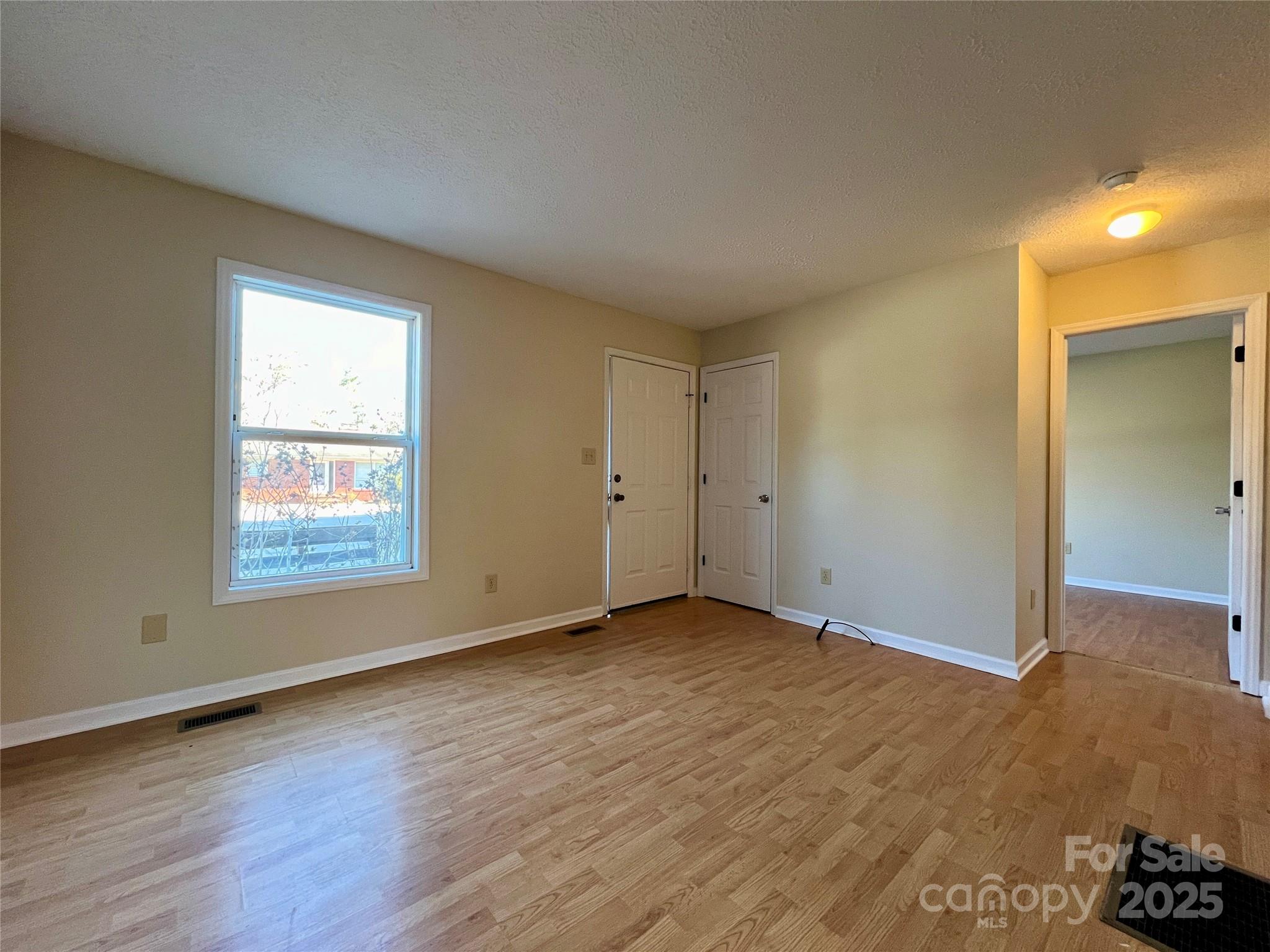 3 Wesley Branch Road Asheville, NC 28806 - Photo 3 of 19 a view of an empty room and window