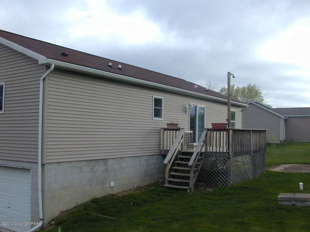 545 Berties Road Stroudsburg, PA 18360 - Photo 2 of 4 a view of a house with a backyard