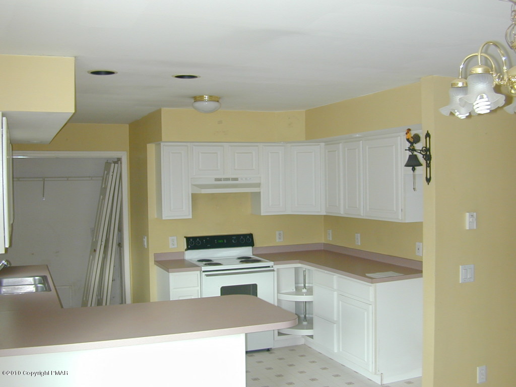 545 Berties Road Stroudsburg, PA 18360 - Photo 3 of 4 a kitchen with a sink appliances and cabinets
