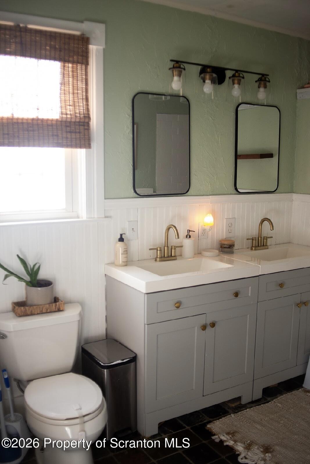 725 Main Street Delta, PA 17314 - Photo 11 of 30 a bathroom with a toilet sink and mirror