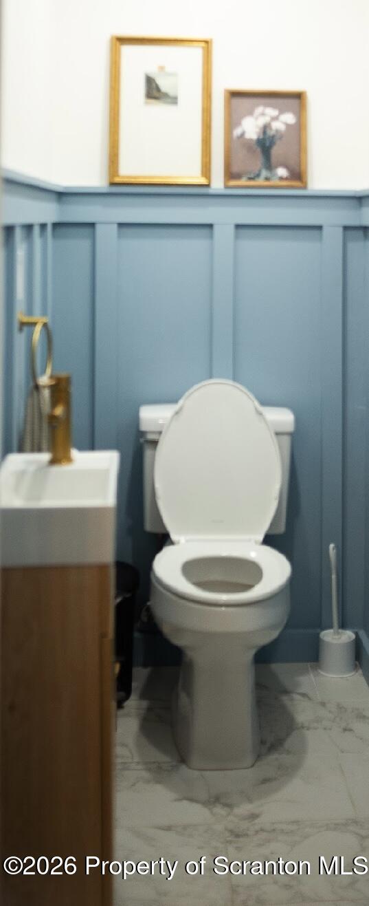 725 Main Street Delta, PA 17314 - Photo 14 of 30 a white toilet sitting next to a bathroom sink