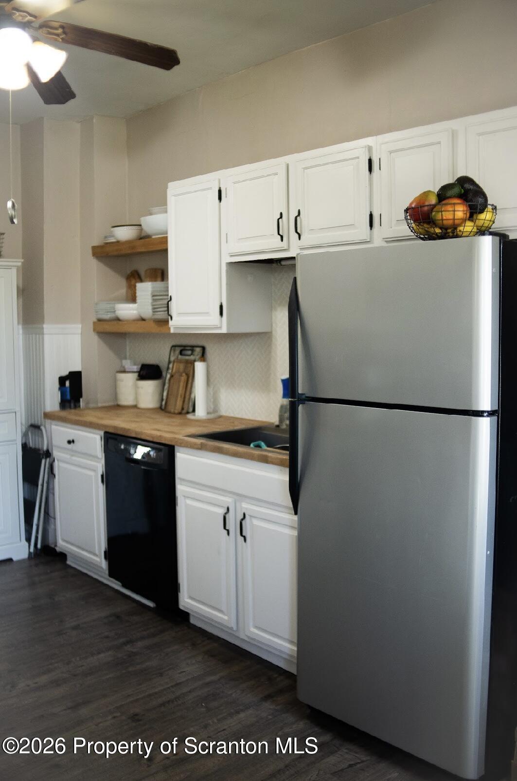 725 Main Street Delta, PA 17314 - Photo 15 of 30 a kitchen with a refrigerator and a sink