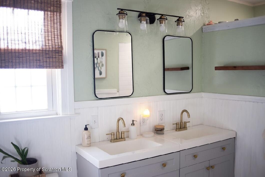 725 Main Street Delta, PA 17314 - Photo 9 of 30 a bathroom with a double vanity sink and mirror