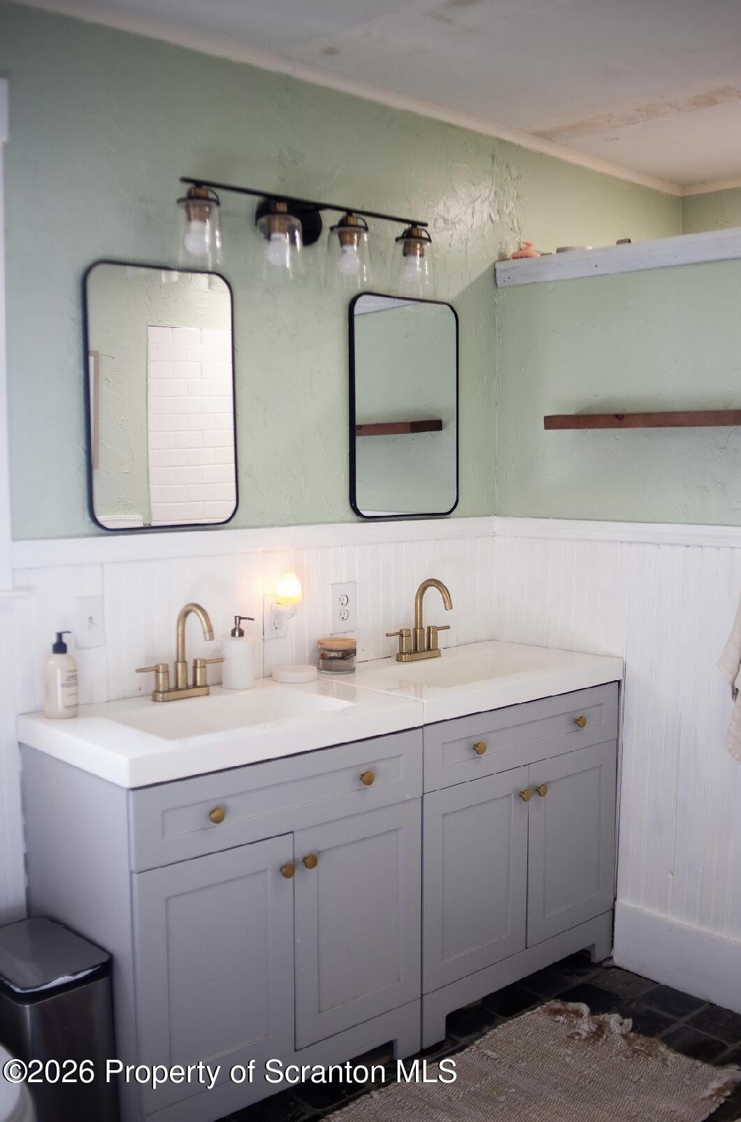 725 Main Street Delta, PA 17314 - Photo 10 of 30 a bathroom with a double vanity sink and a mirror