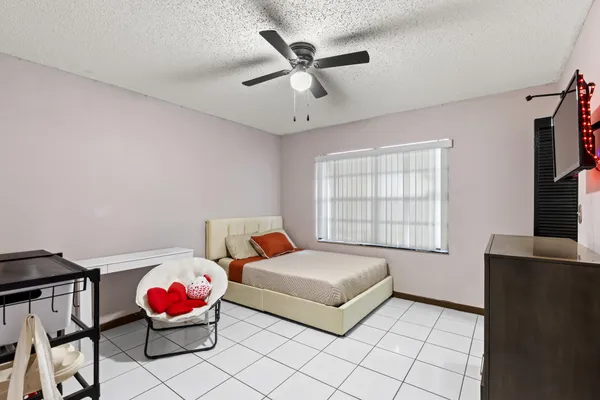 a bedroom with furniture and windows