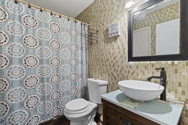 a bathroom with a toilet and a sink