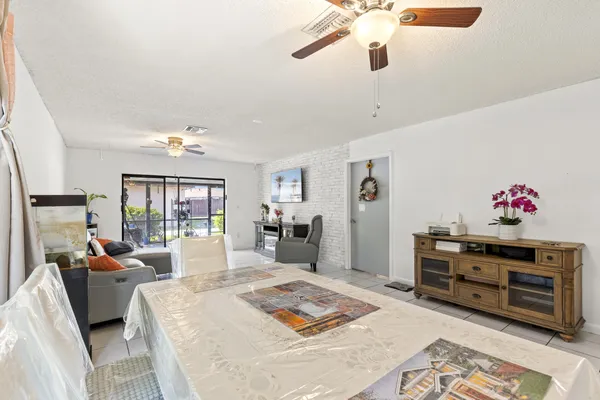 a bed room with furniture and a flat screen tv