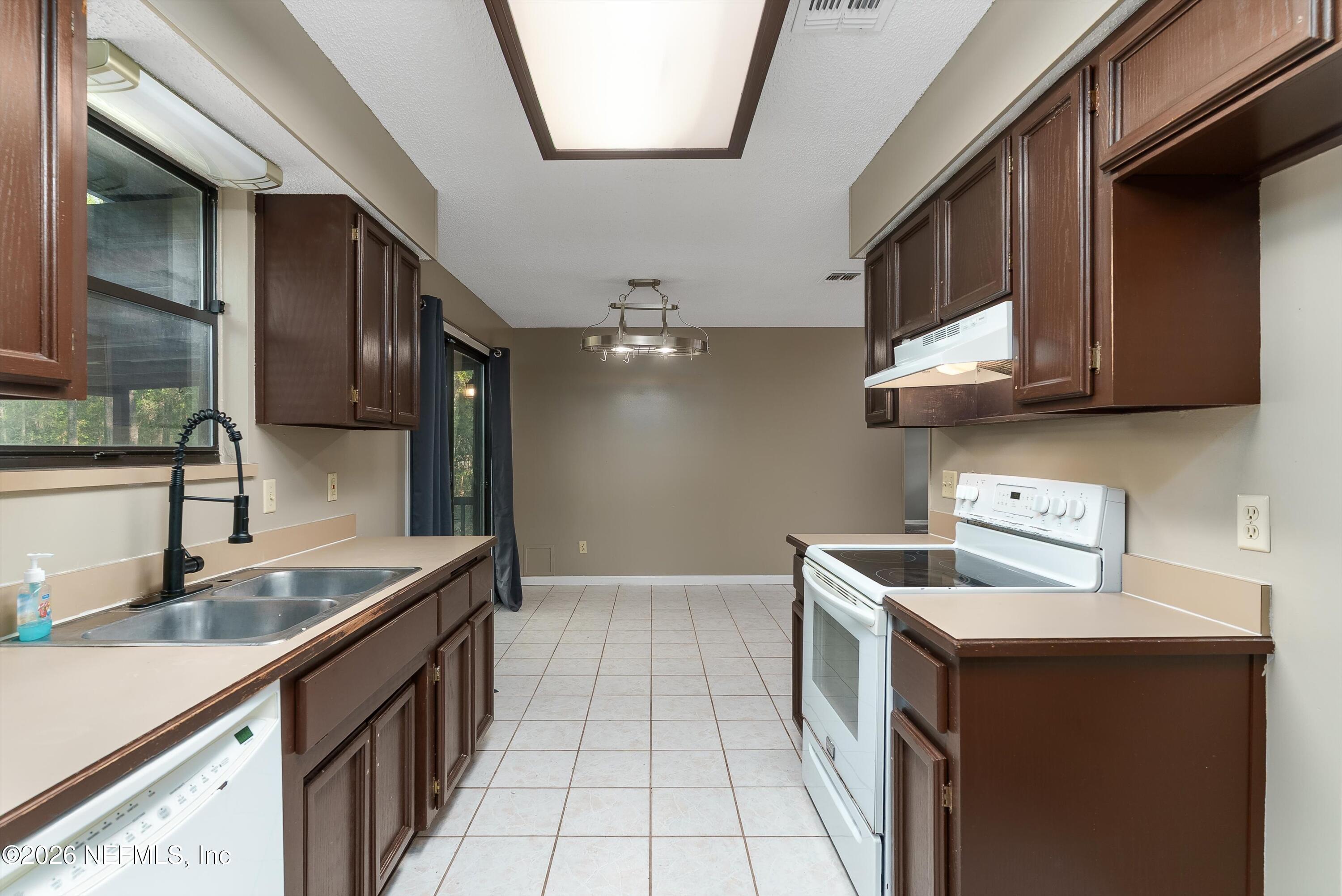 6092 Taylor Road Jacksonville, FL 32234 - Photo 14 of 55 Kitchen to Dining Area