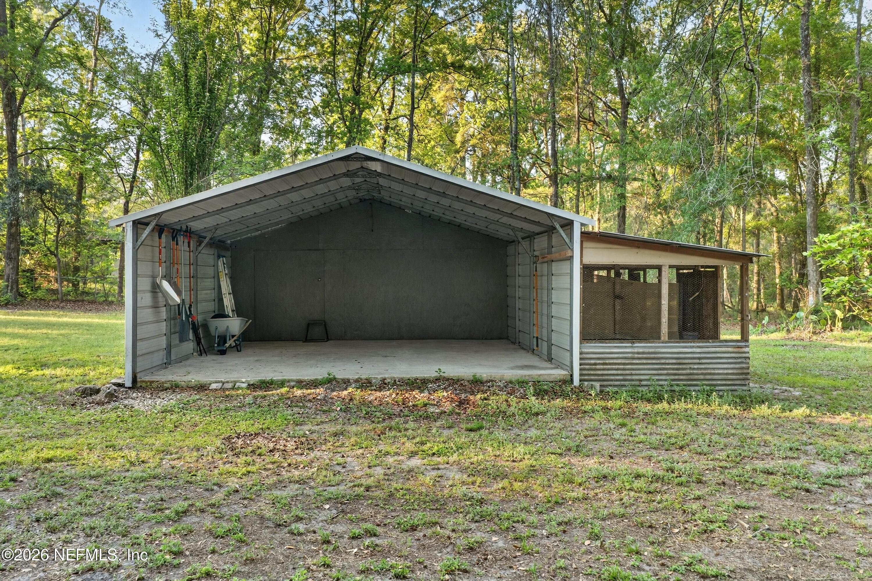 6092 Taylor Road Jacksonville, FL 32234 - Photo 47 of 55 Garage and Animal Pen under Lean-to