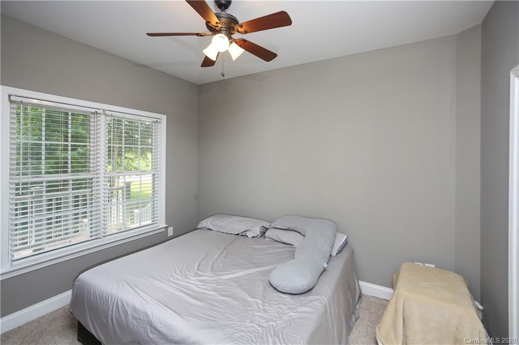 8737 Swift Road Oakboro, NC 28129 - Photo 11 of 19 a bedroom with a bed and a window