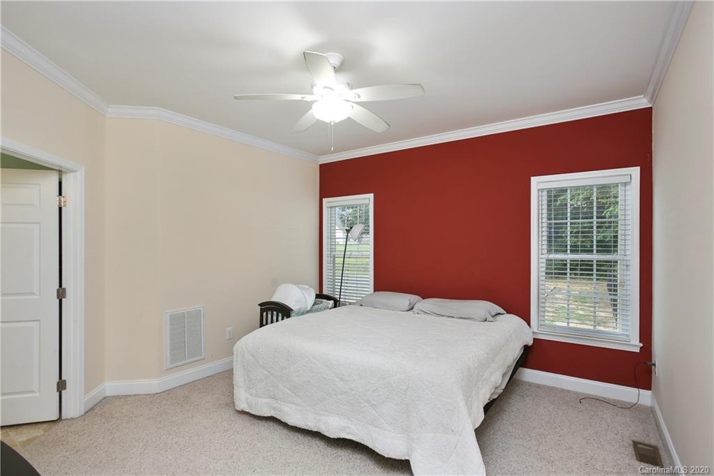 8737 Swift Road Oakboro, NC 28129 - Photo 13 of 19 a bedroom with a bed and a window
