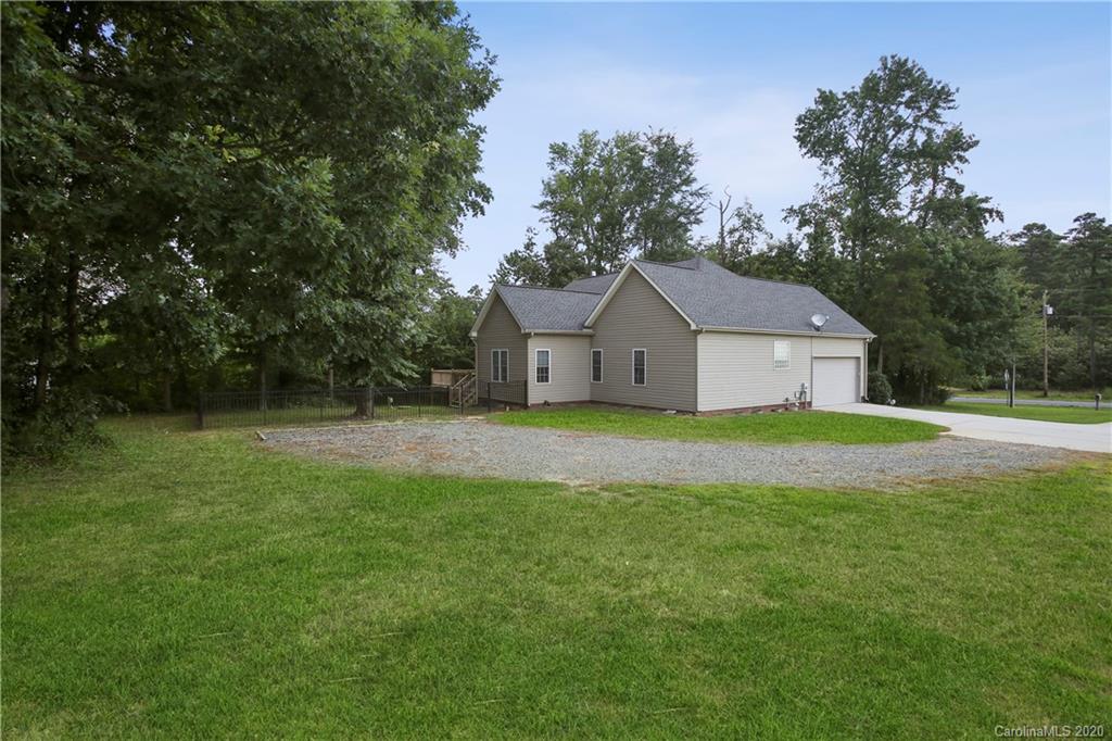 8737 Swift Road Oakboro, NC 28129 - Photo 18 of 19 a house view with garden space