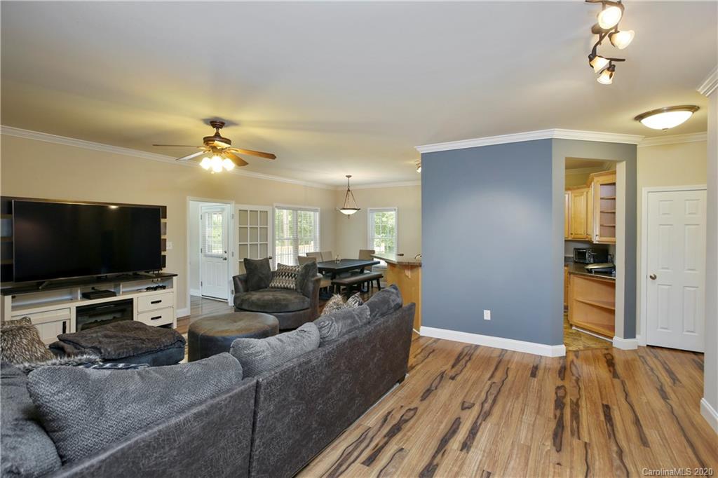 8737 Swift Road Oakboro, NC 28129 - Photo 4 of 19 a living room with furniture and a flat screen tv