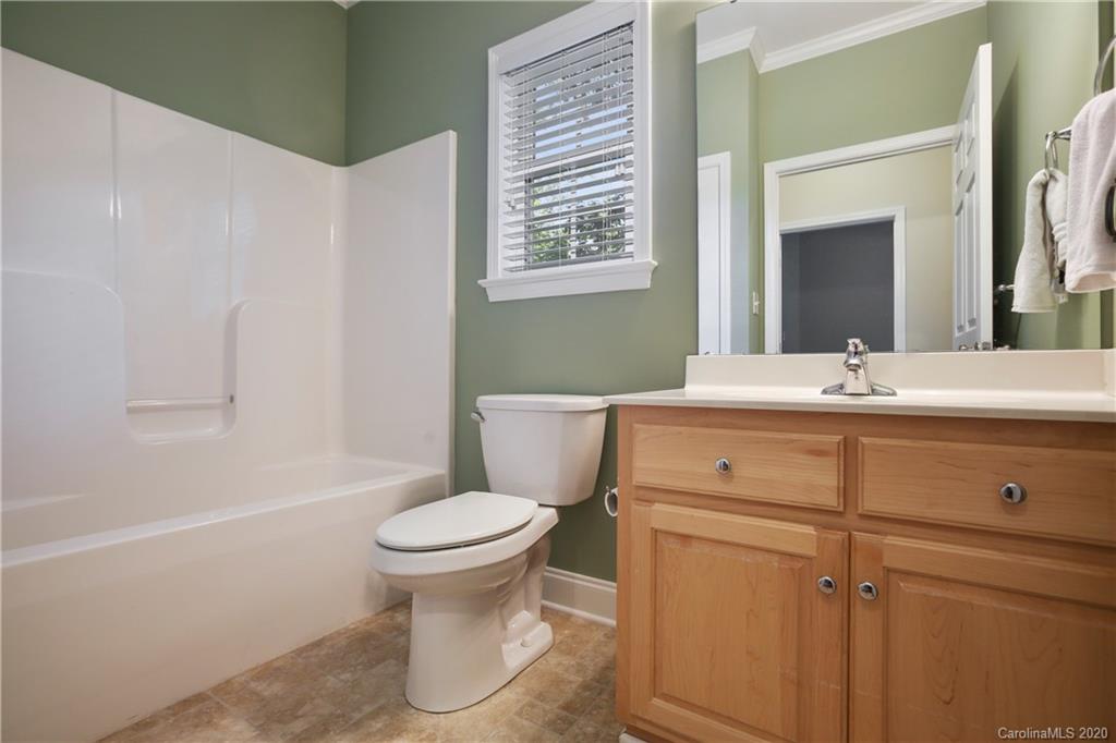 8737 Swift Road Oakboro, NC 28129 - Photo 10 of 19 a bathroom with a sink toilet and shower