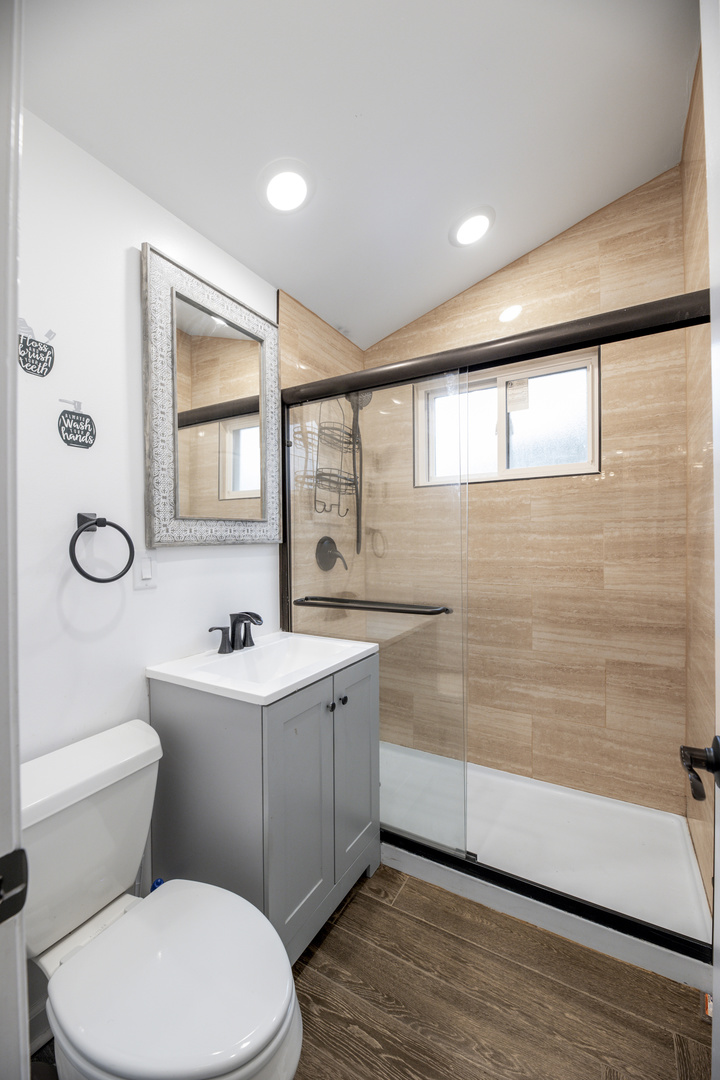 15331 Cherry Lane Markham, IL 60428 - Photo 12 of 23 a bathroom with a toilet a sink a mirror a vanity and window