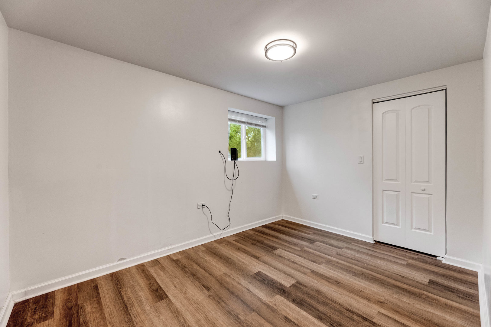 15331 Cherry Lane Markham, IL 60428 - Photo 17 of 23 a view of empty room with wooden floor and fan