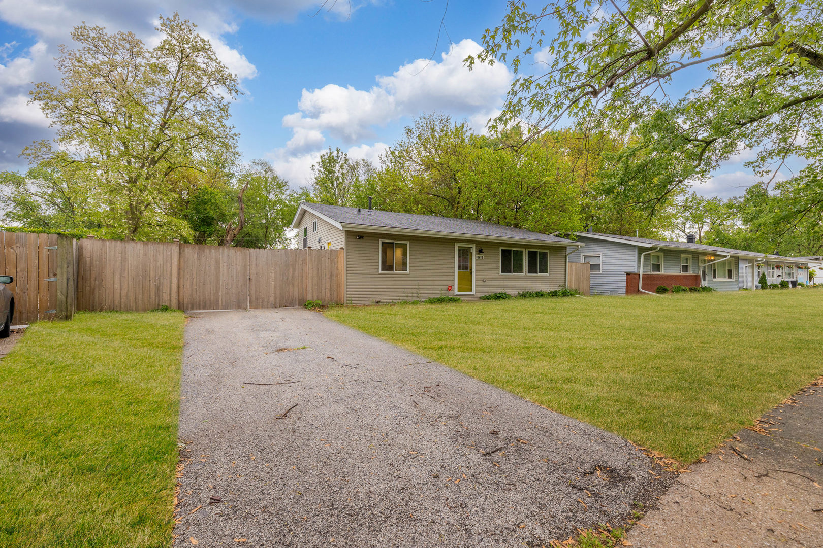 15331 Cherry Lane Markham, IL 60428 - Photo 2 of 23 a front view of house with yard and trees