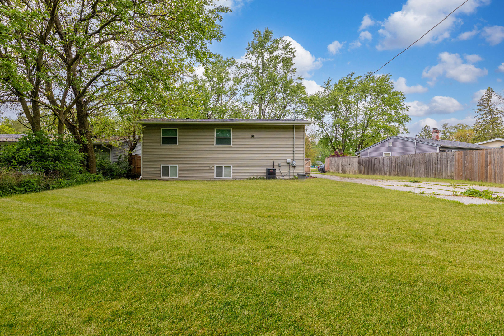 15331 Cherry Lane Markham, IL 60428 - Photo 21 of 23 a house with swimming pool in front of it