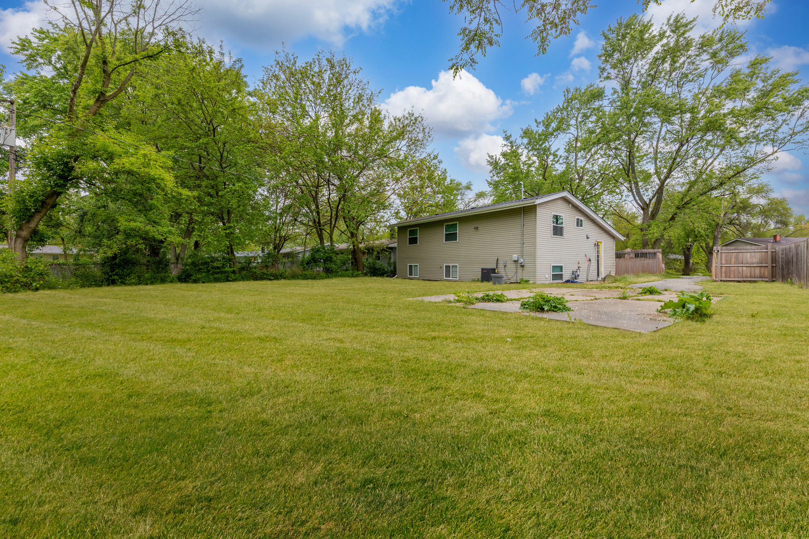 15331 Cherry Lane Markham, IL 60428 - Photo 22 of 23 a view of house with backyard and tree