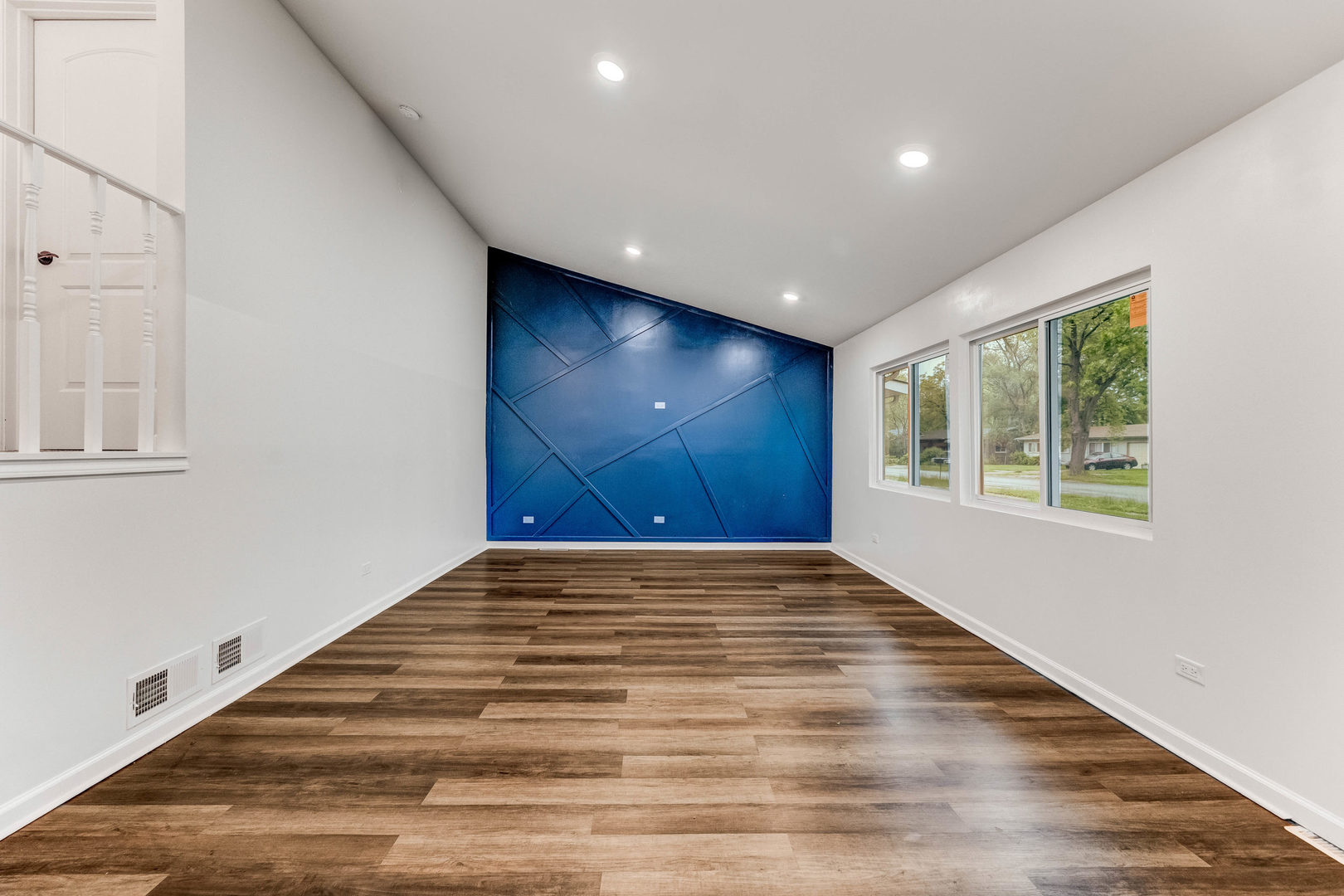 15331 Cherry Lane Markham, IL 60428 - Photo 3 of 23 a view of an empty room with wooden floor and a window