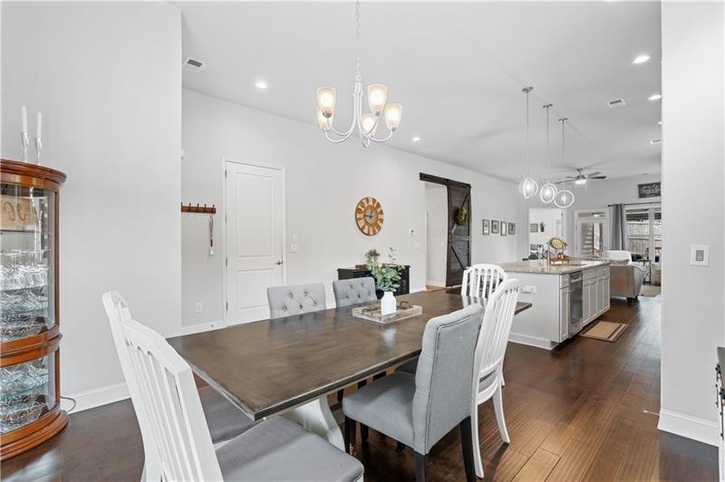 141 Fieldbrook Crossing Canton, GA 30115 - Photo 11 of 45 a view of a dining room with furniture and wooden floor