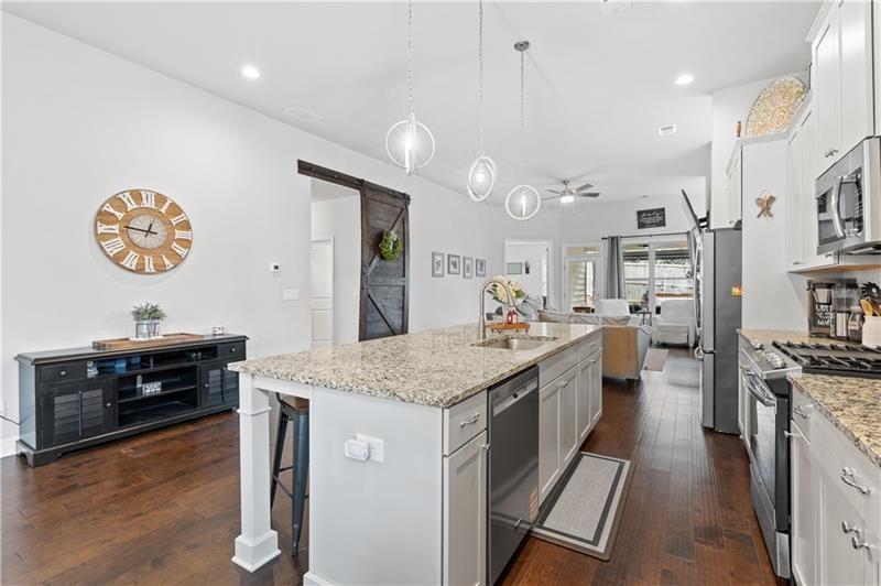 141 Fieldbrook Crossing Canton, GA 30115 - Photo 12 of 45 an open kitchen with a sink and stove