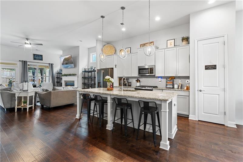 141 Fieldbrook Crossing Canton, GA 30115 - Photo 13 of 45 a large kitchen with cabinets table and chairs